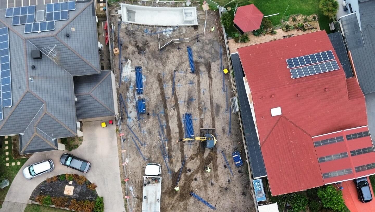 Aerial of a multi-house residential development with screw piles installed