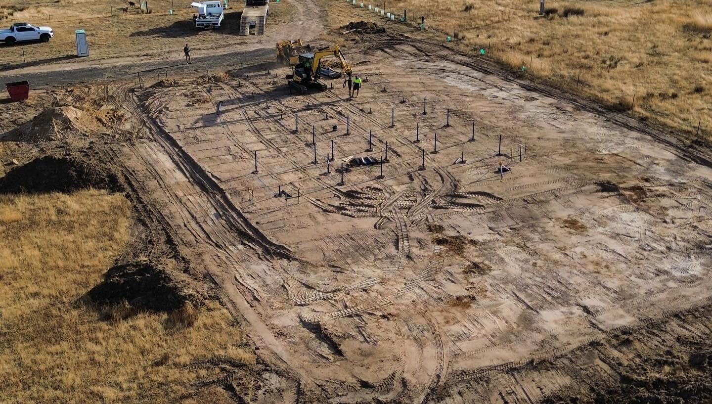 Aerial view of a completed rural screw pile pad ready for build