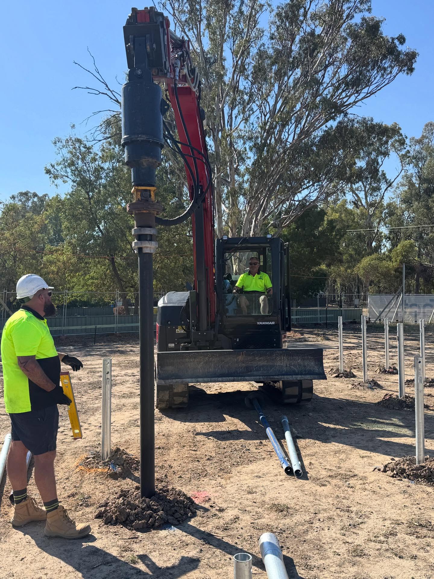 Total Piling crew installing screw piles on a Victorian rural site - the standard application for the piles we also supply direct