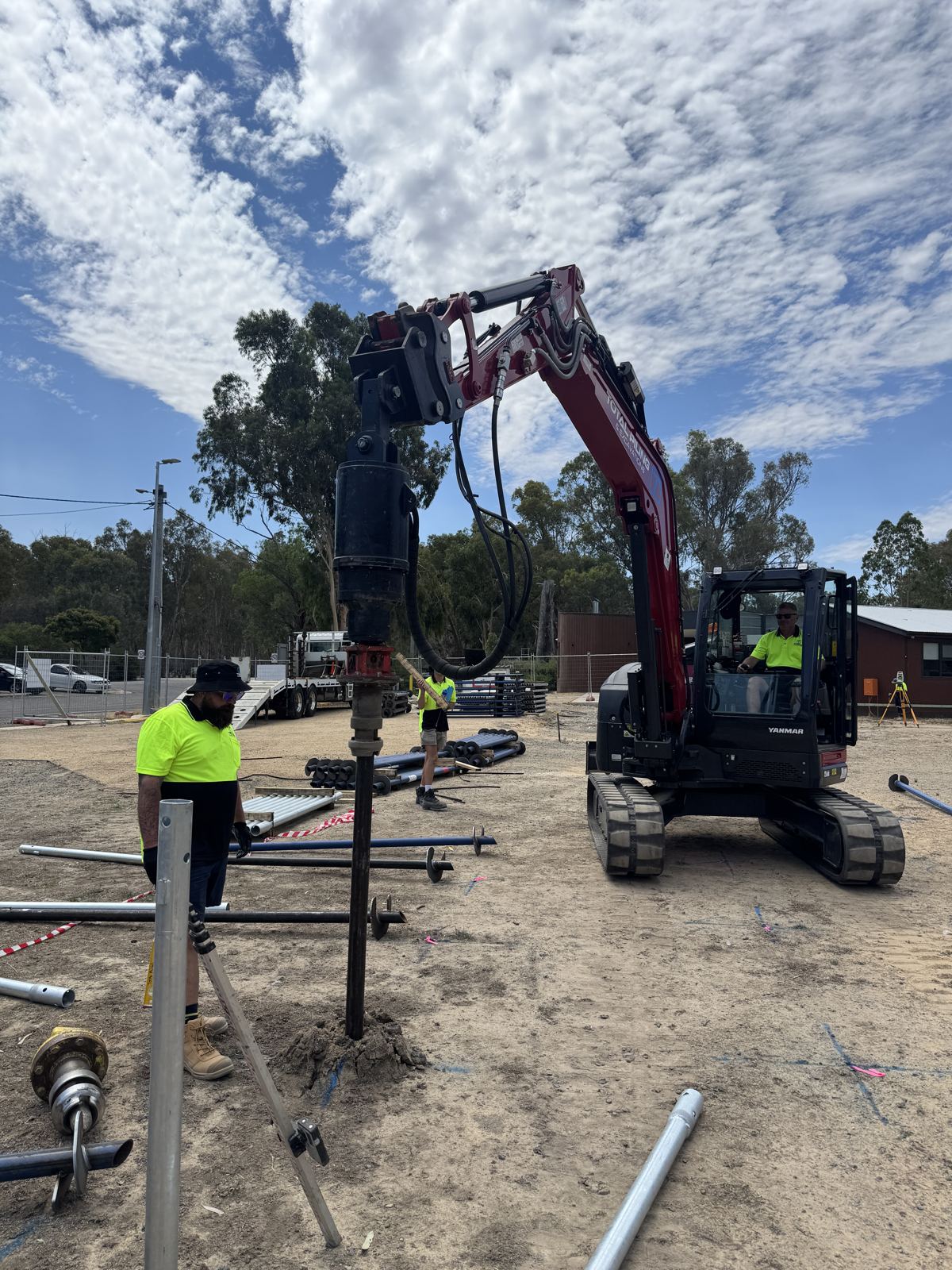 Total Piling crew installing screw piles with a tracked drive rig on a regional Victorian site